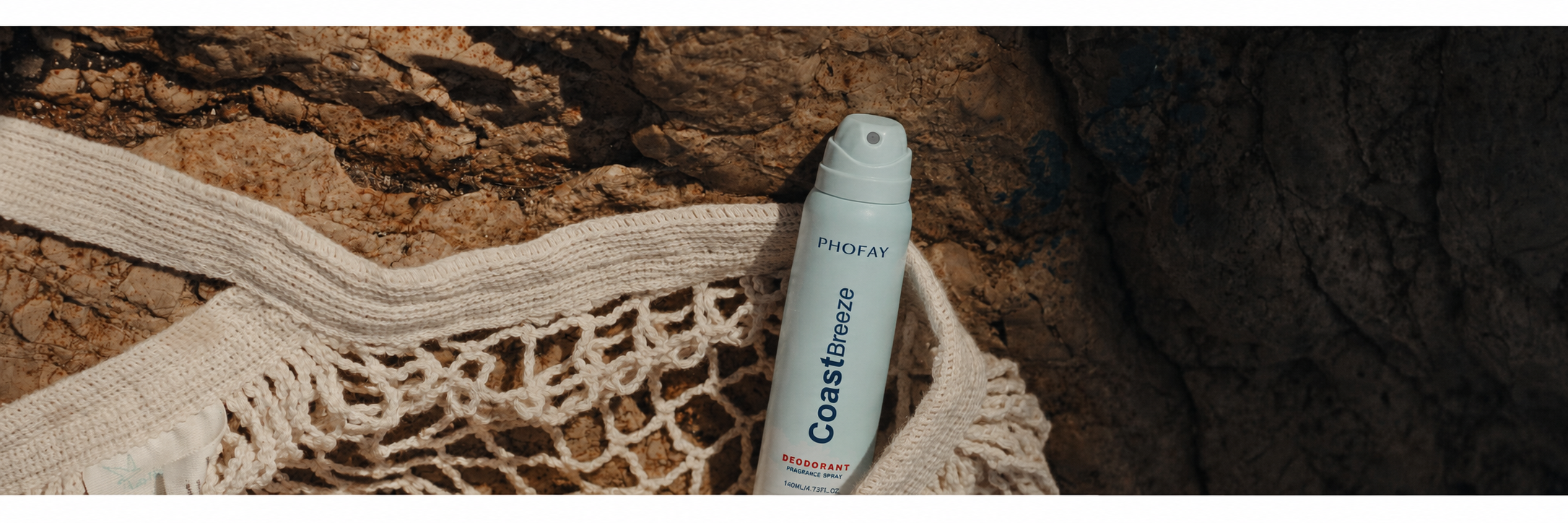 CoastBreeze spray in a woven beach bag